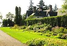 The garden wall is one feature amidst towering trees on a lakefront property now subdivided at Roches Point, ON