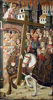 King Heraclius triumphantly returns the Holy Cross to Jerusalem on a brown horse accompanied by a host of figures both laypeople, clergy, and women. Saint Helena is prominently but anachronistically depicted on a white horse. An angel looks on above.