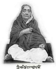 A Bengali woman , sitting