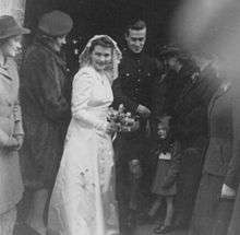 Photograph of screenwriter William Rose on his wedding day in 1944, along with his wife and guests.