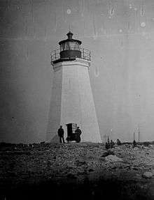 A black and white photograph of Black Rock Harbor Light