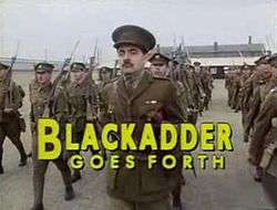 Title screen of Blackadder Goes Forth featuring lead actor Rowan Atkinson as a First World War captain, marching in the foreground of his platoon on a military parade ground. The title of the series is presented in bold, capitalised yellow letters.