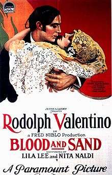 Film poster showing a stylised image of Rudolph Valentino with a woman in her arms, They appear to be about to kiss, or have just kissed. The film's name and other details are shown at the bottom.