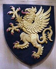 The Badge, roughly shield-shaped, shows a gold griffin on a black background