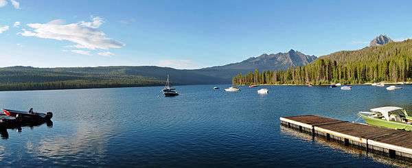 Boats and the docks at Redfish Lake with the Sawtooth Mountains in the background