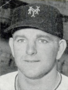 A close-up of a man wearing a baseball cap with an "NY" on the cap.