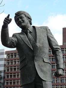 Close-up of a bronze statue of Sir Bobby Robson, former Ipswich and England manager, in one of his typical poses