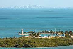 Aerial view of Boca Chita Key with the skyline of Miami in the distance