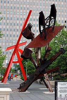 Outdoor sculptures of Mark di Suvero: Johnny Appleseed  with  Orion in the background.