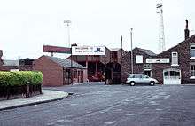 The entrance to the Bootham Crescent association football ground, the entrance sign and a stand visible