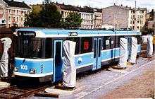 A light-blue tram