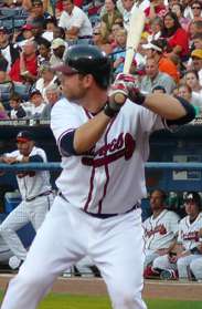 Brian McCann, dressed in the Atlanta Braves' home whites, stands ready at the plate