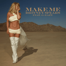 The artwork portrays Spears walking in a desert-like area, with her being scantily dressed in white material.