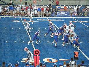A play during a game between Boise State and Louisiana Tech on Bronco Stadium's blue-colored artificial turf
