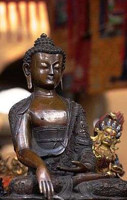 Photo of bronze statue of Buddha at the Sikkim Pavilion