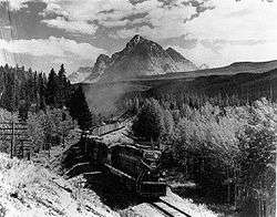 Image of a Canadian National Railways EMD GP9 locomotive climbing in the Yellowhead Pass