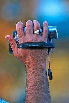 Small camcorder being operated with one hand