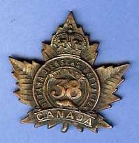 Battalion cap badge, featuring maple leaf and number 38