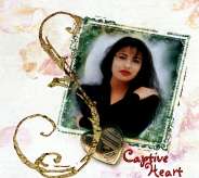 A cover album of a vertical cropped picture of a woman (Selena) who is posing with one of her hands on her opposite shoulder and her other hand holding her waist. The letter "S" is displayed with the "Captive Heart" written at the near bottom. A photo locket is right beneath the picture.
