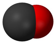 A large black spherical object with a slightly smaller red one merging into it from the right