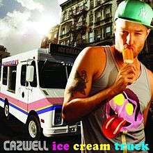 Cazwell, wearing a Count von Count T-shirt, is seen eating ice cream behind an ice cream truck and a building.