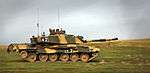 photo of a Challenger 2 tank at speed on grassy plain