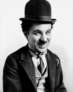 Charlie Chaplin, wearing a bowler hat