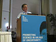  photo of Chris French presenting from podium at the World Skeptics Congress 2012 in Berlin