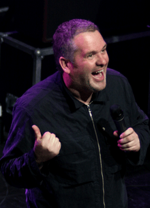 Colour photograph of Chris Moyles onstage in 2011.
