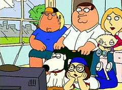 A still frame of a cartoon family gathered together in the couch and the floor watching the television