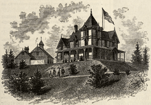 Lithograph depicting a Victorian mansion with gothic turrets on a hill. A large American flag flies over the house.