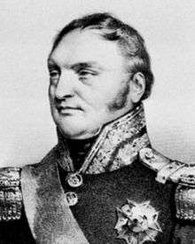 Black and white print shows a confident-looking man with long sideburns and a receding hairline. He wears a dark military uniform with a high collar, epaulettes, and one decoration.