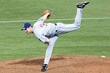 A man in a pitching motion