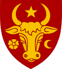 A shield depicting the head of an aurochs, surrounded by a star, a crescent and a flower