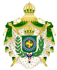 Coat of arms consisting of a shield with a green field with a golden armillary sphere superimposed on the red and white Cross of the Order of Christ, surrounded by a blue band with 20 silver stars; the bearers are two arms of a wreath, with a coffee branch on the left and a flowering tobacco branch on the right; and above the shield is an arched golden and jeweled crown