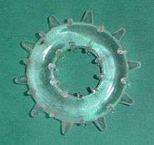 a clear, soft plastic ring with knobs