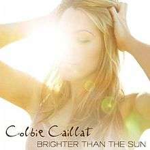 The sun takes over Calliat's face as she grabs her hair.