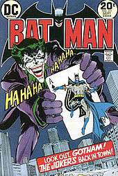 "Batman" cover, with the Joker holding an ace of spades with Batman on it
