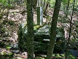 Connecticut-Massachusetts state line boundary marker in Sages Ravine near Connecticut Route 41 and Mount Riga State Park