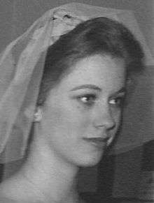 A black and white image of Booth with what appears to be a veil on her head.
