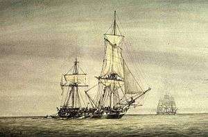 In the open sea a frigate is severely mauled by combat, with her rigging spilling over the sides while another frigate sails in the background.