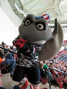 South Carolina Stingrays mascot Cool Ray wearing a military themed jersey and a patriotic top hat.
