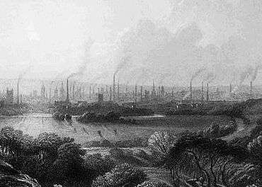 Engraving of a view of Manchester from a distance, showing factories, smokestacks, and smoke.