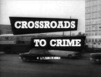 A black-and-white shot of a road filled with cars and buses, in front of background buildings, has the title "Crossroads to Crime" superimposed in the centre
