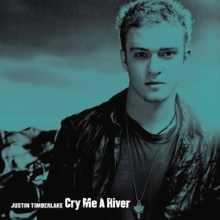 A blueish colored portrait of a young blonde-haired man who is wearing a black shirt and a black leather jacket. In the left bottom corner is written his name "Justin Timberlake" and the track's title 'Cry Me a River' in white letters.