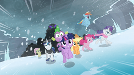 A group of multicolored ponies flee from an ominous dark cloud while surrounded by ice.