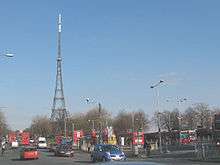Photograph of Crystal Palace bus station, with the Crystal Palace transmitter featuring prominently in the background.