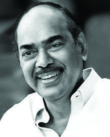 Black & white image of a man with black moustache.