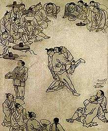 The painting titled "Sangbak" (상박; 相撲) drawn by Kim Hong-do illustrates people gathering around to watch a ssireum competition in the late 18th century.