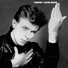 The album cover features a black and white photograph of Bowie's face with his hands held up